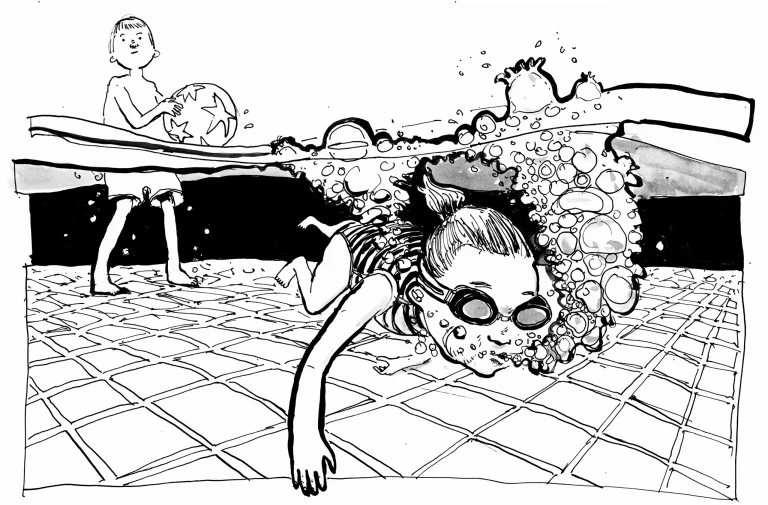 A girl in goggles diving underwater in a hotel swimming pool